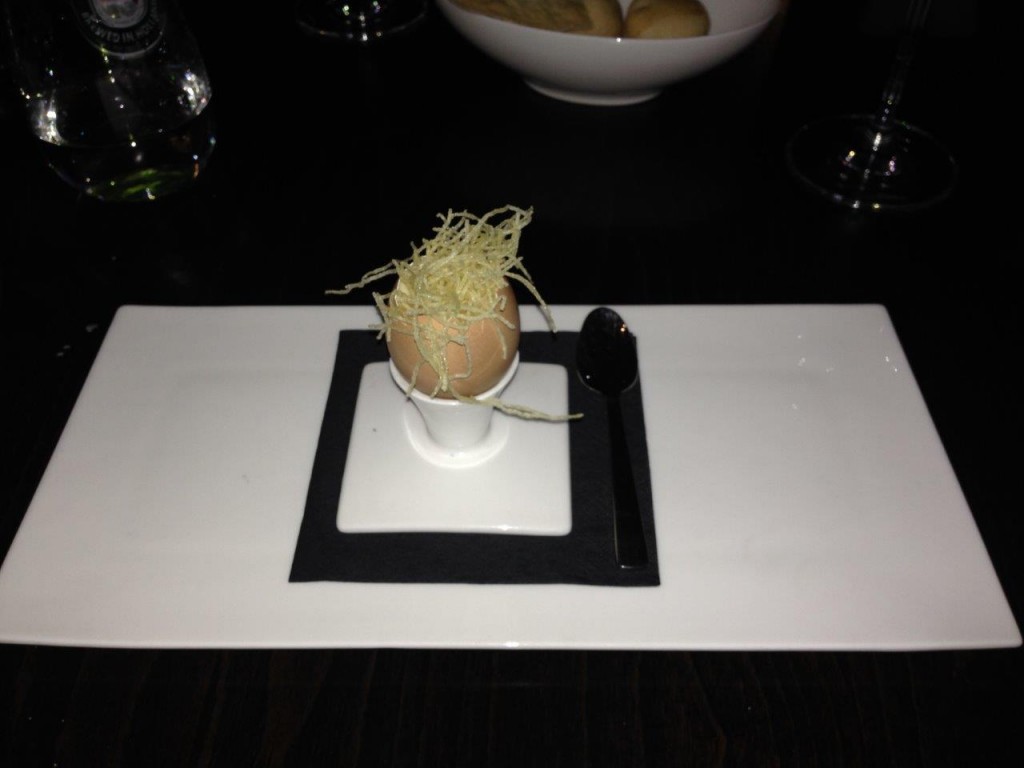 a delicious carbonara sauce served in the shell of an egg.